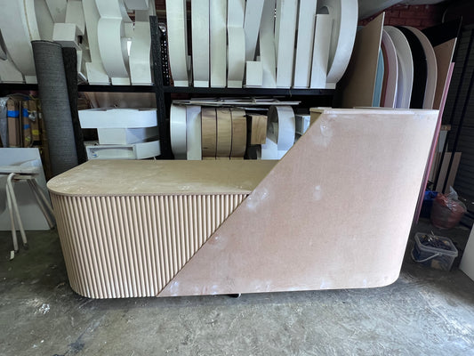 Desk with custom ripple paneling