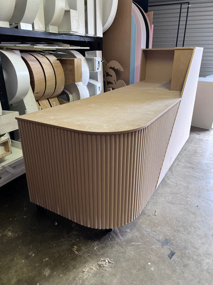 Desk with custom ripple paneling